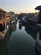 夕阳箫鼓几船归